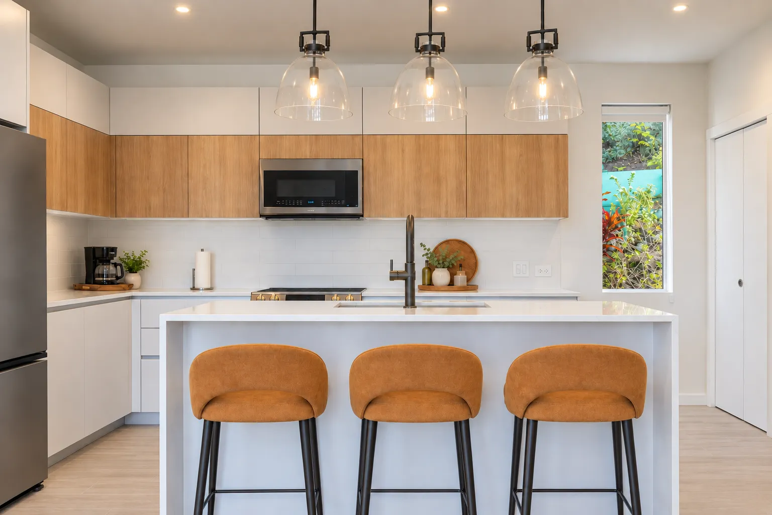 Kitchen with oak cabinetry and island seating at Sugar Ridge