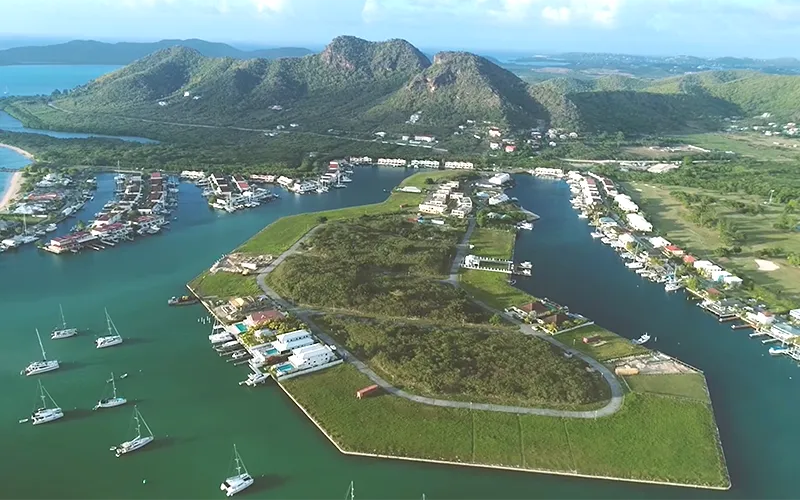 Aerial view of Harbour Island and the Jolly Harbour marina, setting for The Gardens, Antigua
